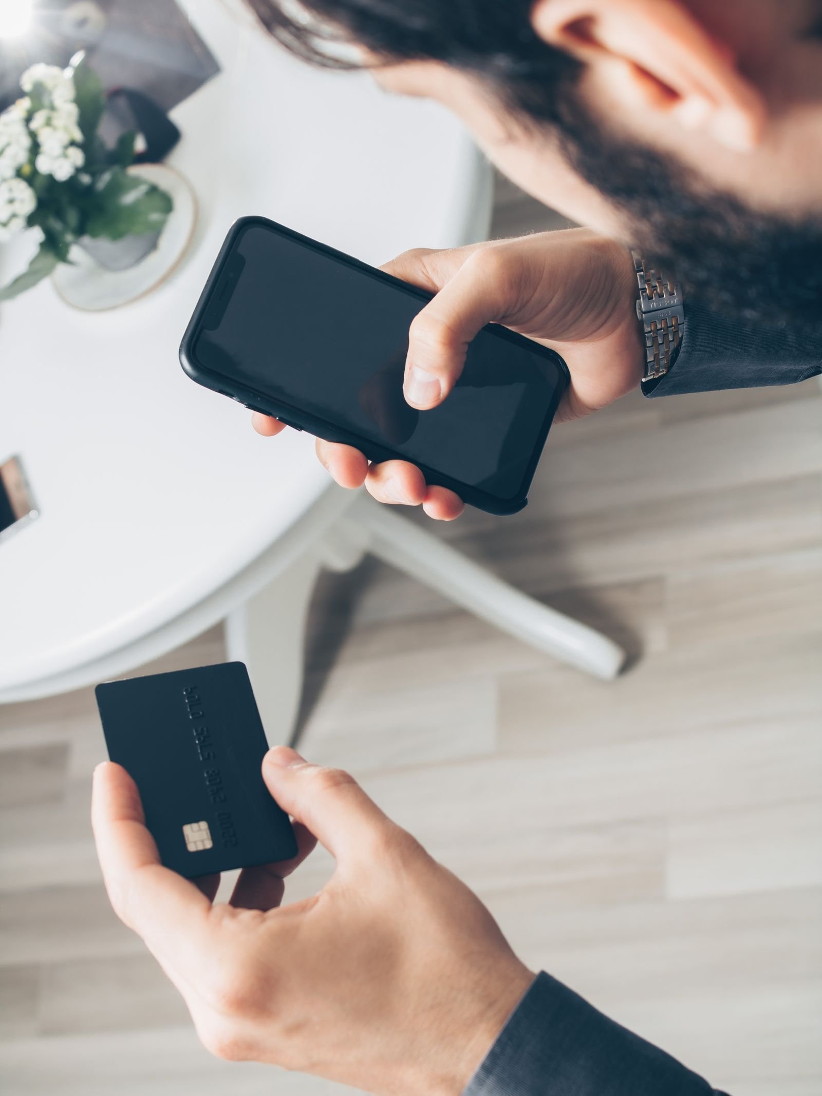 Customer paying with a smartphone and credit card through a digital wallet